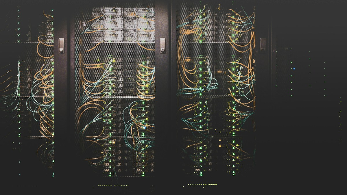 Cloud infrastructure engineers monitoring 99.9% high-availability Cloud LMS clusters, CDN video streaming, and zero-trust firewall dashboards